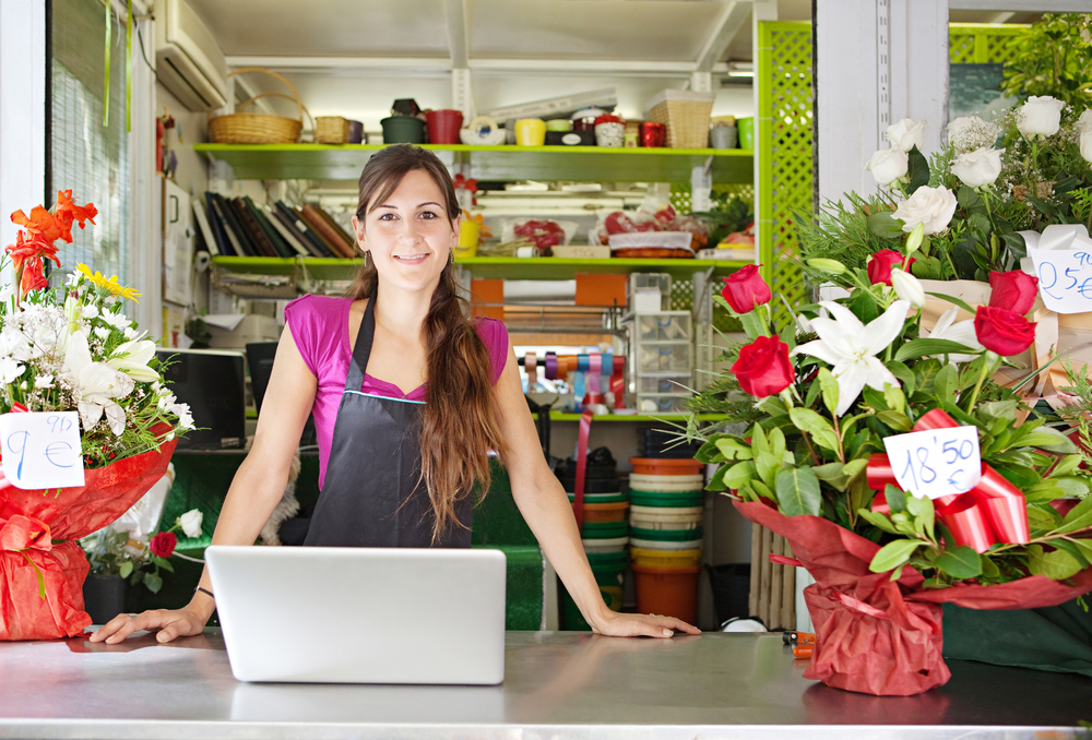 A flower shop owner is selling orders online.