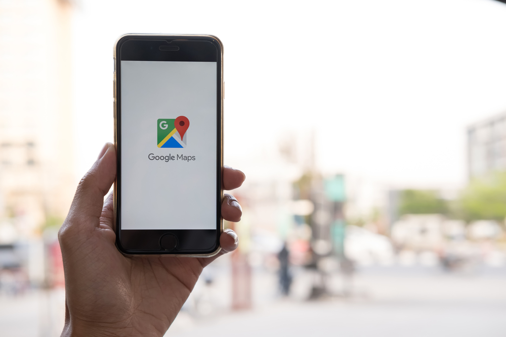 A cell phone is displaying a Google Maps app